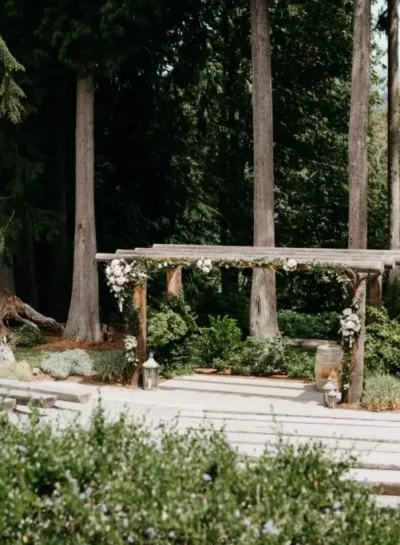 Mountain and Forest Wedding Venue with Log Trellis and Bench Seating in the Woods| Snohomish Wedding Venue The Lookout Lodge